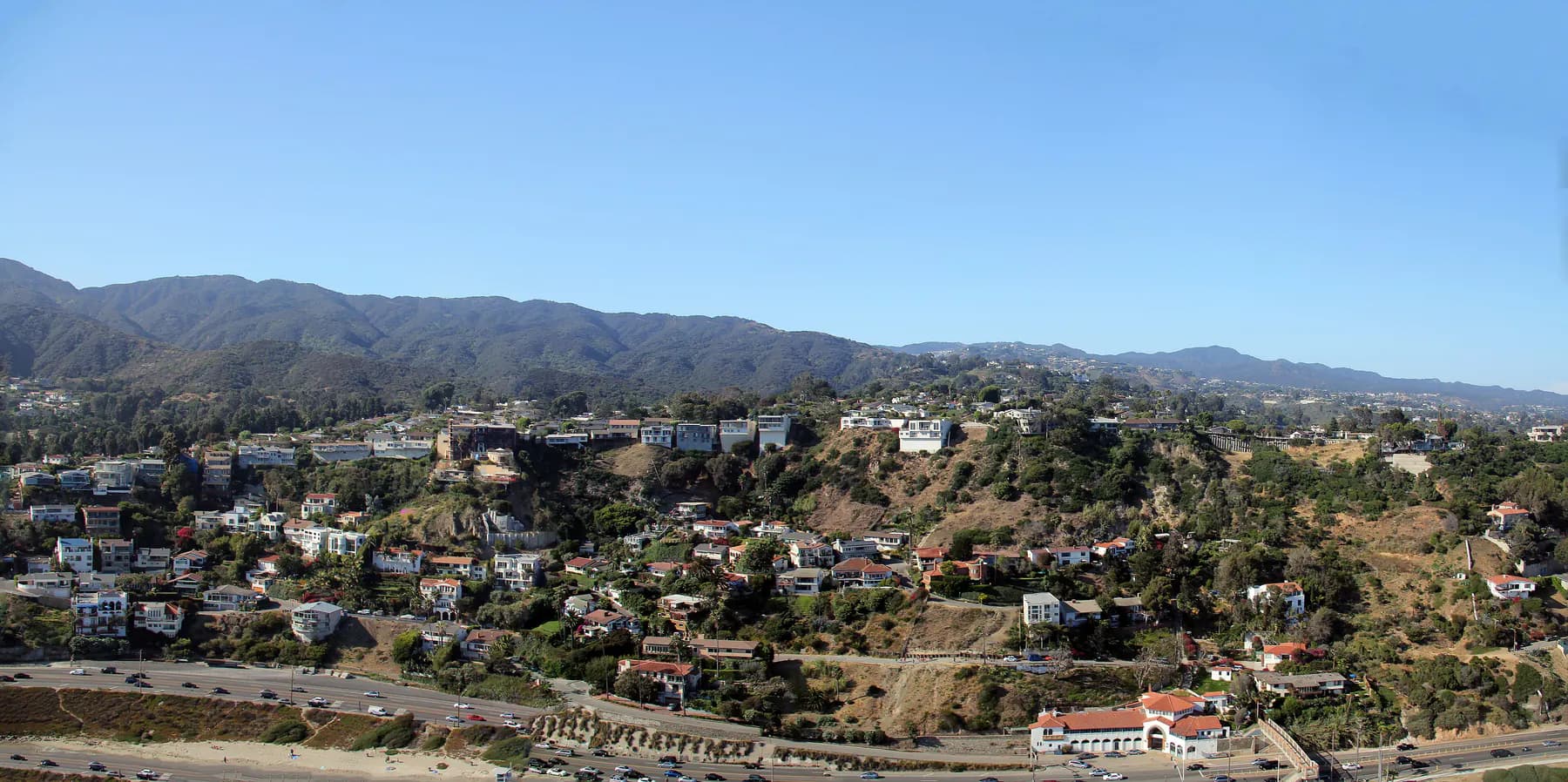 Pacific coastline, hillside, and coastal road viewed from above near Pacific Palisades